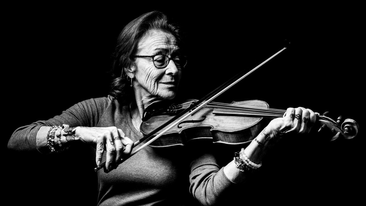 Metis woman learning to play the fiddle | London Photography Awards
